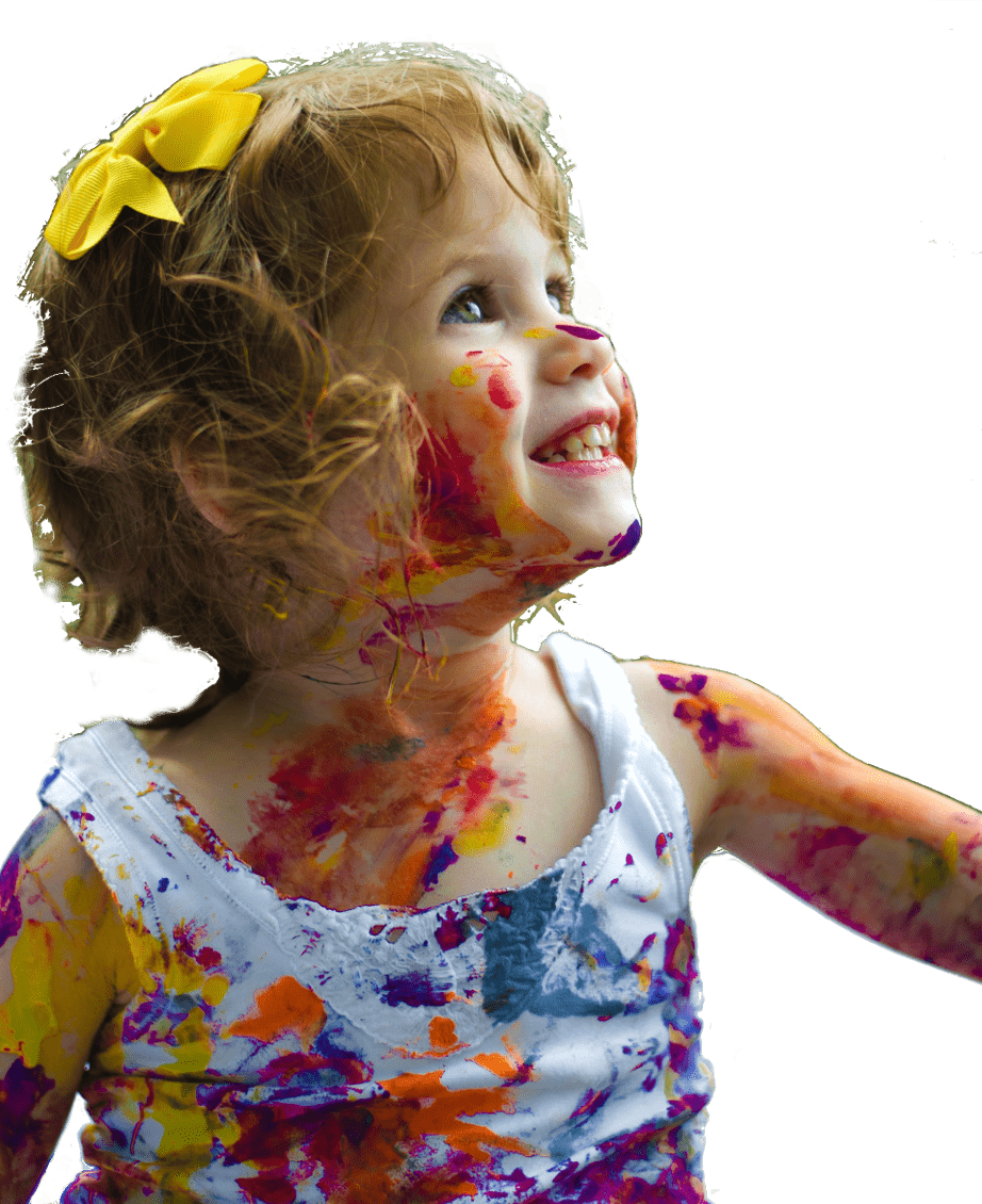 Grinning child with paint over clothes and face